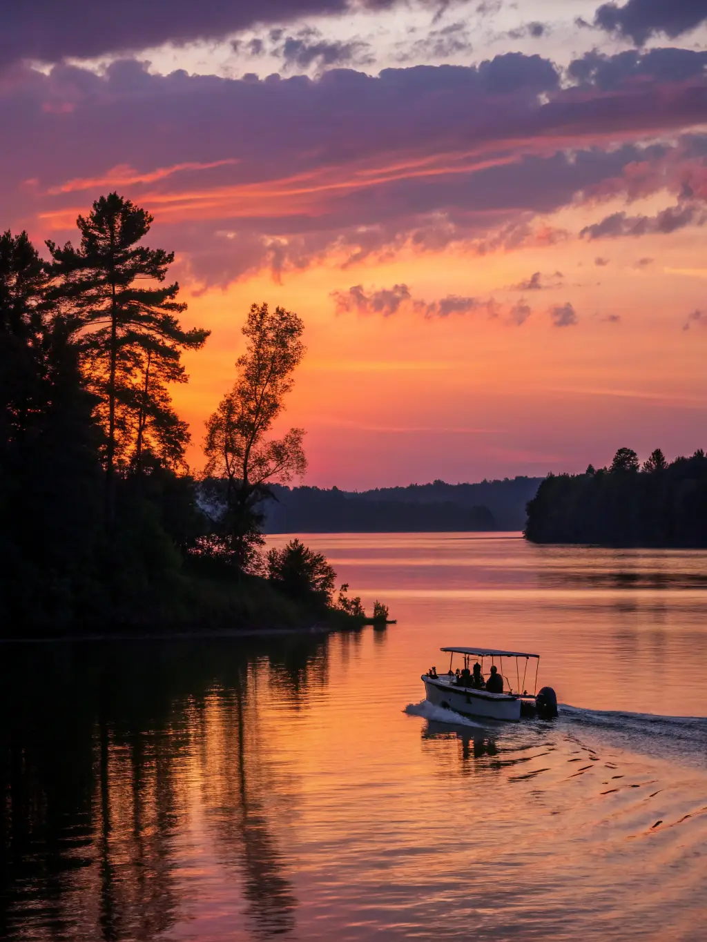 A serene image of a group enjoying a leisurely sunset sail on a catamaran, emphasizing relaxation and the beauty of the sea.
